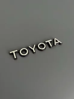 Шильдик TOYOTA на багажник автомобиля